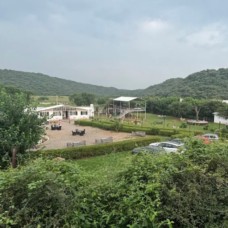 Camping tents set up at dusk in the Aravalli wilderness near Gurgaon